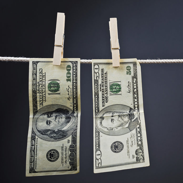 American Dollars hanging on rope