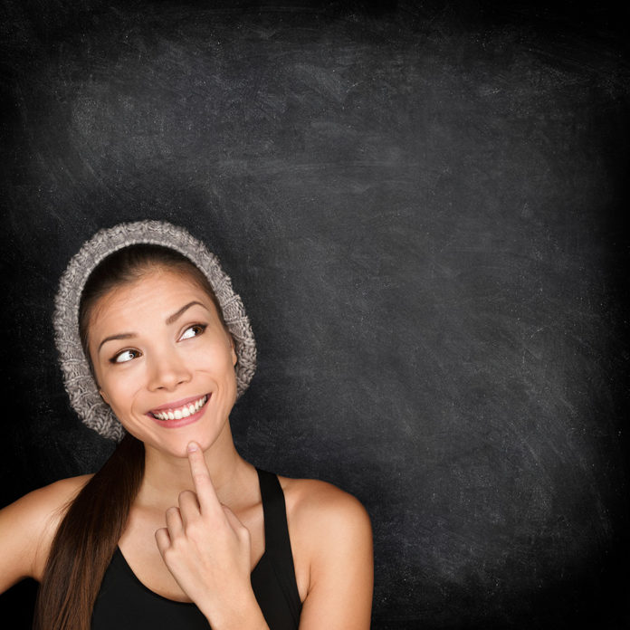 Thinking woman by blackboard woman destiny