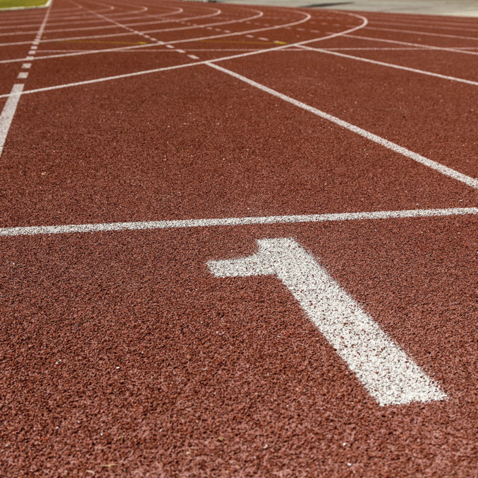 The beginning of the athletics track. the start of the athletics track